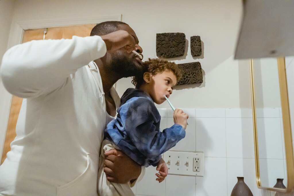 father and son brushing