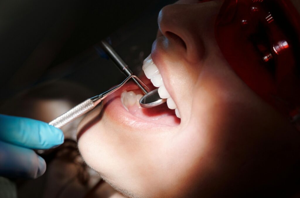 dentist looking in a patients mouth